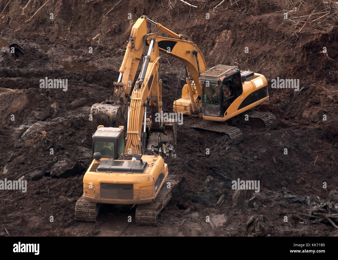 Two excavators on the construction of the new facility. Stock Photo
