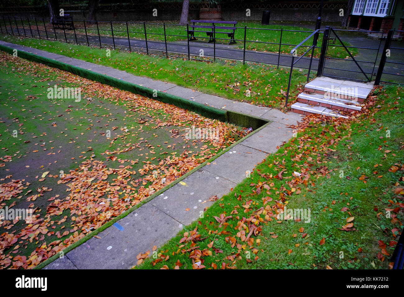Bowling green covered in leaf litter in Luton, Bedfordshire, England Stock Photo