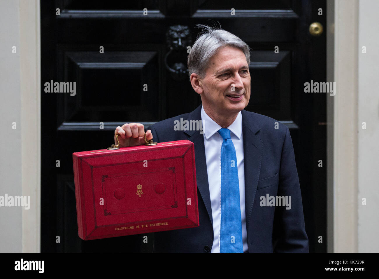 London, UK. 22nd November, 2017. Philip Hammond MP, Chancellor of the Exchequer, holds up the red case as he leaves 11 Downing Street to make his Budg Stock Photo