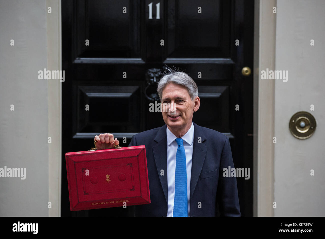 London, UK. 22nd November, 2017. Philip Hammond MP, Chancellor of the Exchequer, holds up the red case as he leaves 11 Downing Street to make his Budg Stock Photo