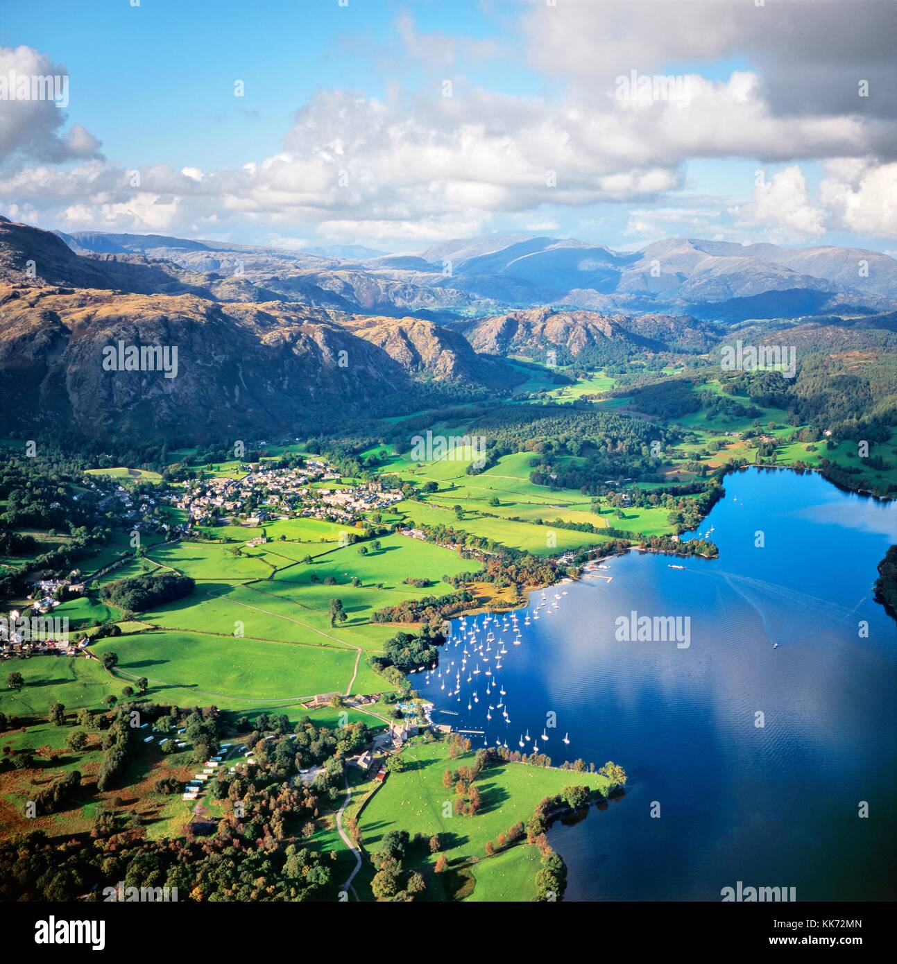 North over Coniston Lake, Coniston village and Yewdale Fells to Helvellyn in the Lake District National Park, Cumbria, England Stock Photo