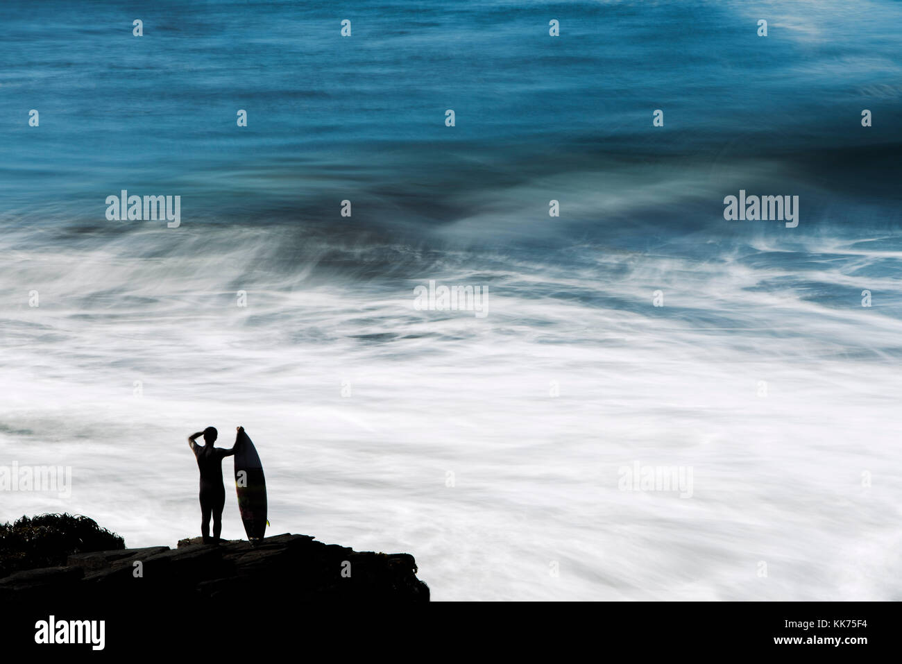 Surfer standing surfboard on hi-res stock photography and images - Alamy