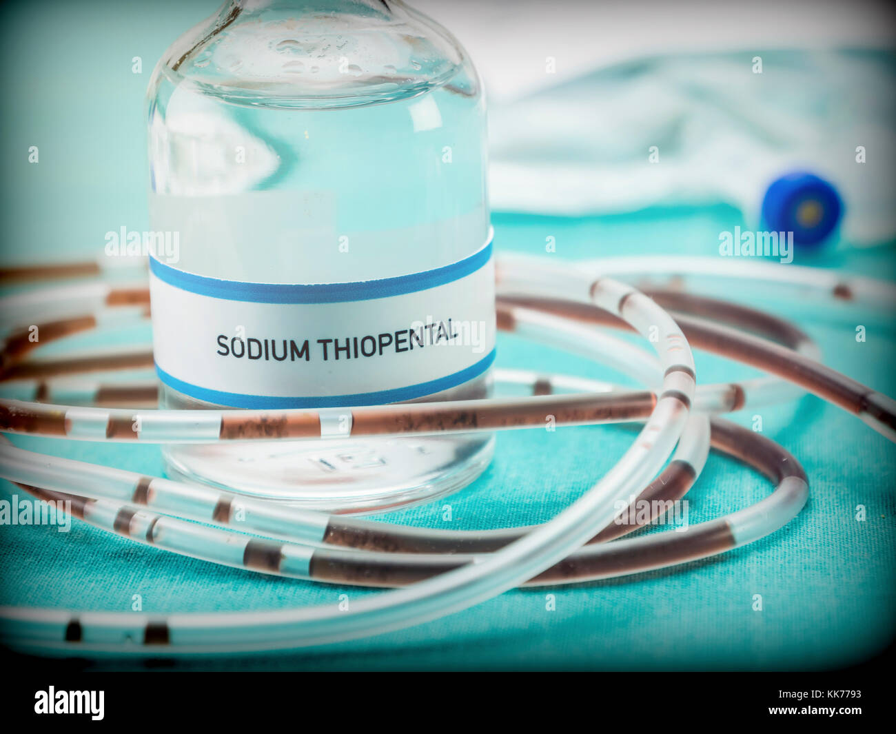 Rubber drip irrigation system with traces of blood along with vial of