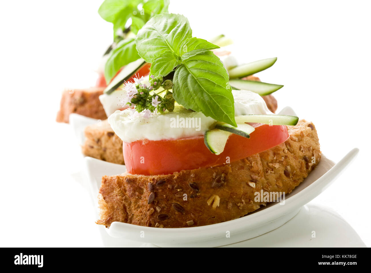 photo of delicious tomato mozzarella starter isolated white background