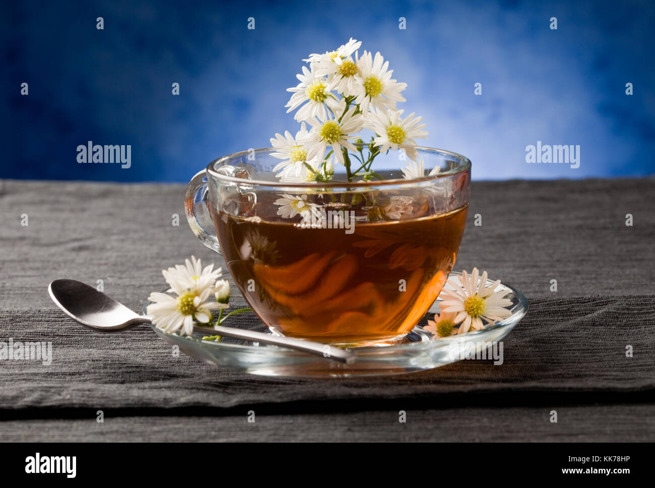 photo of delicious chamomile tea with marguerite reflecting on the tea