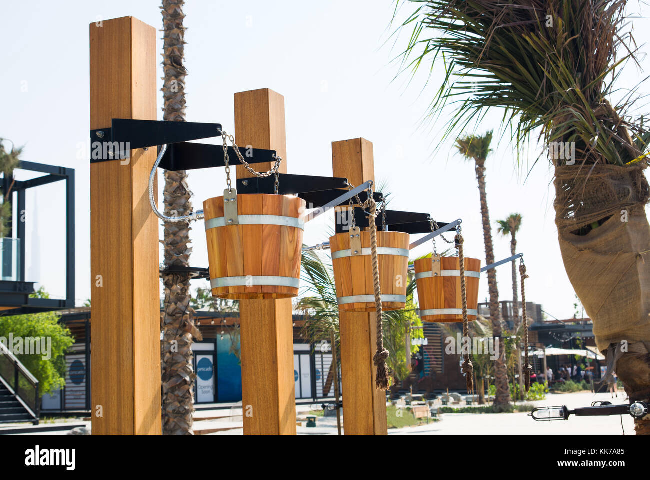 Creative showers in wooden buckets on a beach Stock Photo Alamy