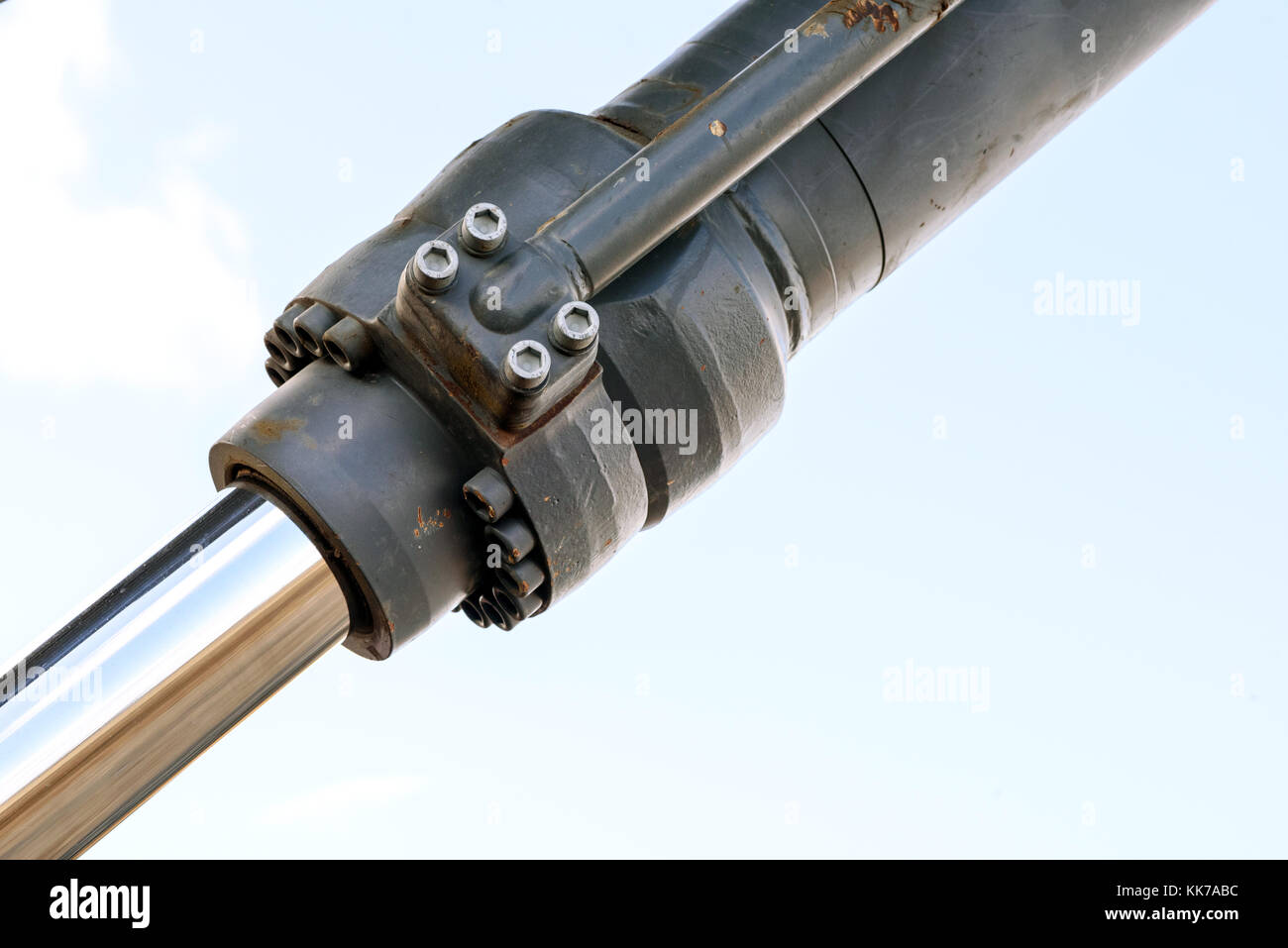 Black hydraulic arm of a digger excavator earthmoving machine with a