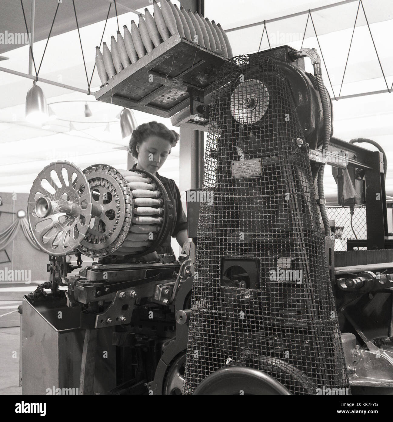 1950s, historical, women working at a cotton spinning or weaving machine. Stock Photo