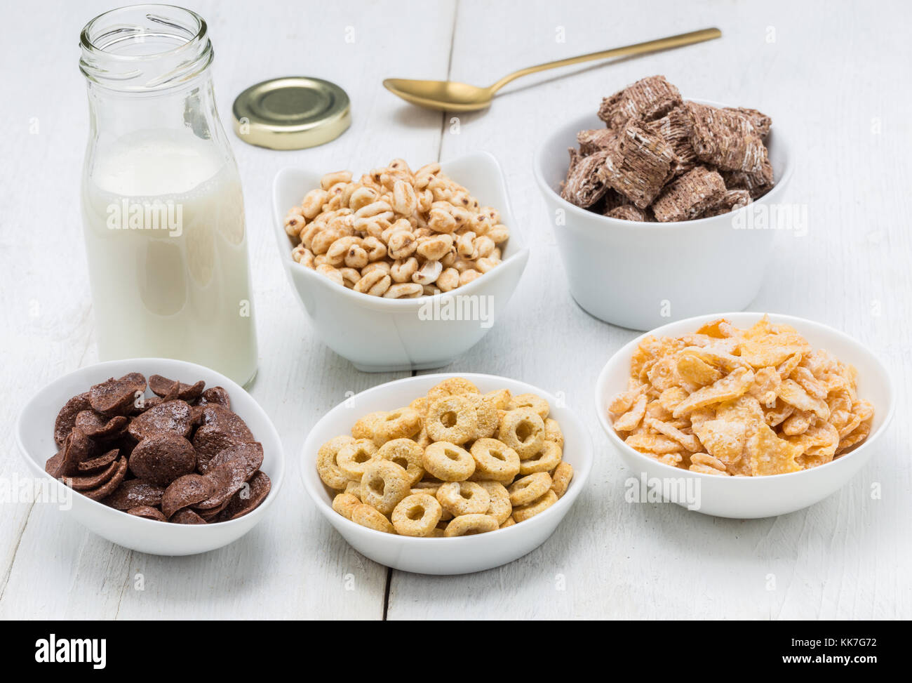 Various conrflake cereals in bowls and milk Stock Photo Alamy