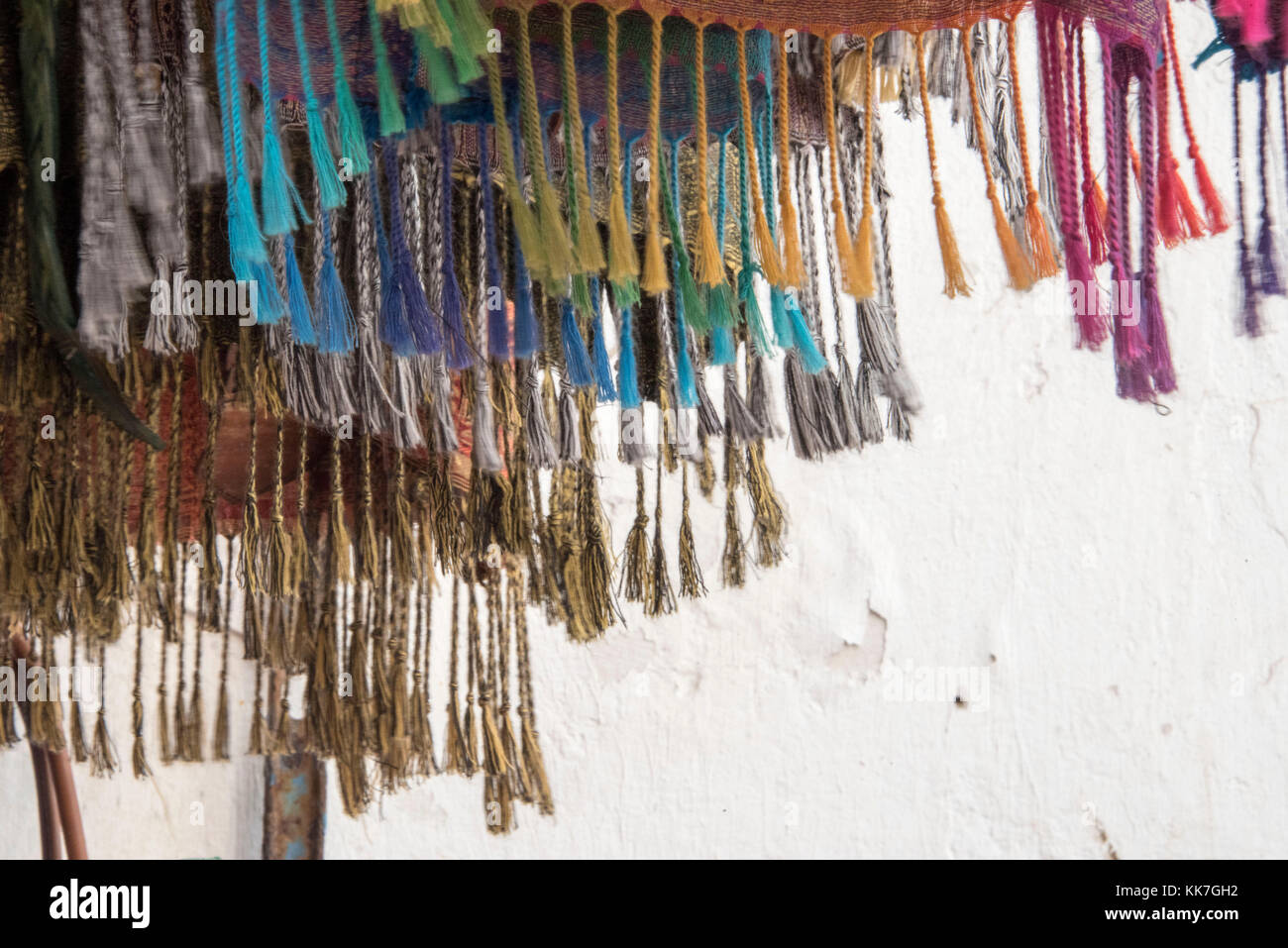 fringes on colorful textiles on sale in a Moroccan Market Stock Photo