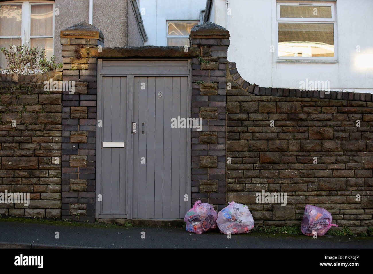 Pink bags used for the household recycling of plastics and bins used