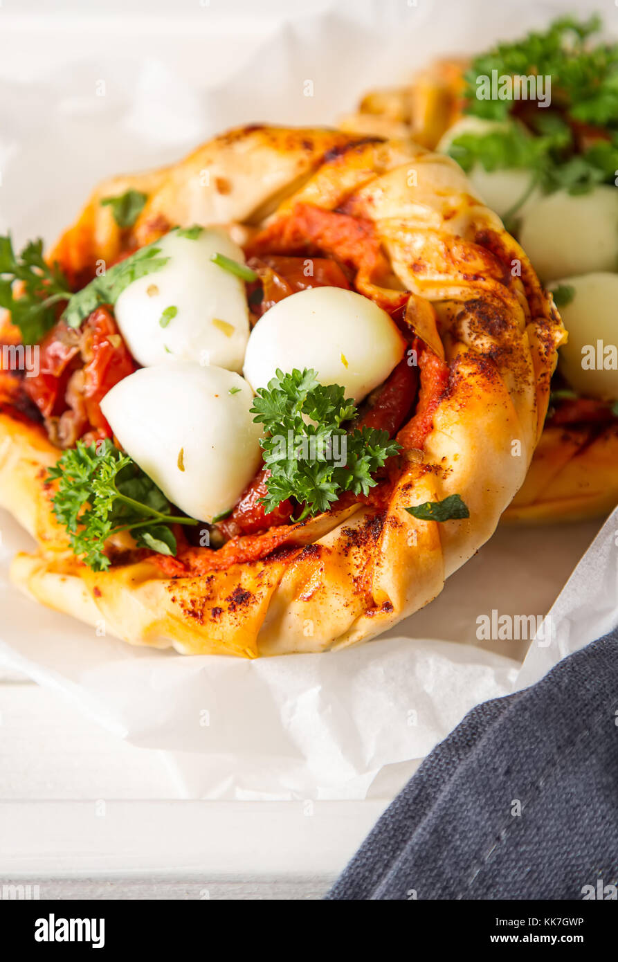 Pie in the oriental style. Filo pastry with tomato and mozzarella