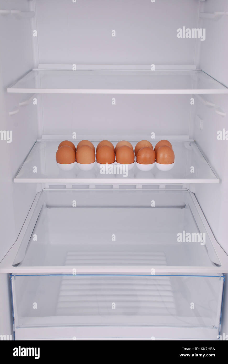 One eggs in open empty refrigerator. Weight loss diet concept Stock