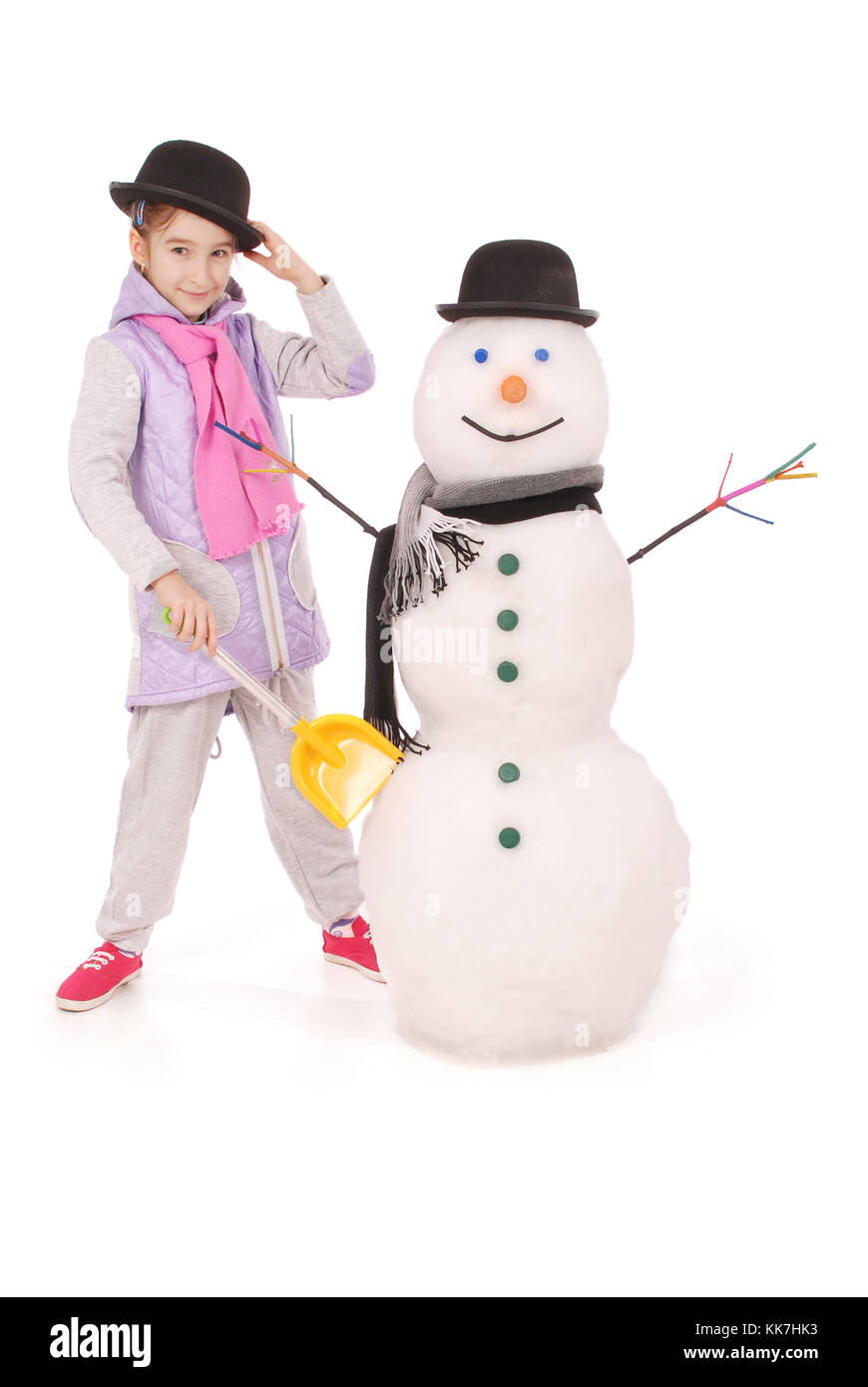 Cute girl with snowman with scarf and hat on white background Stock ...