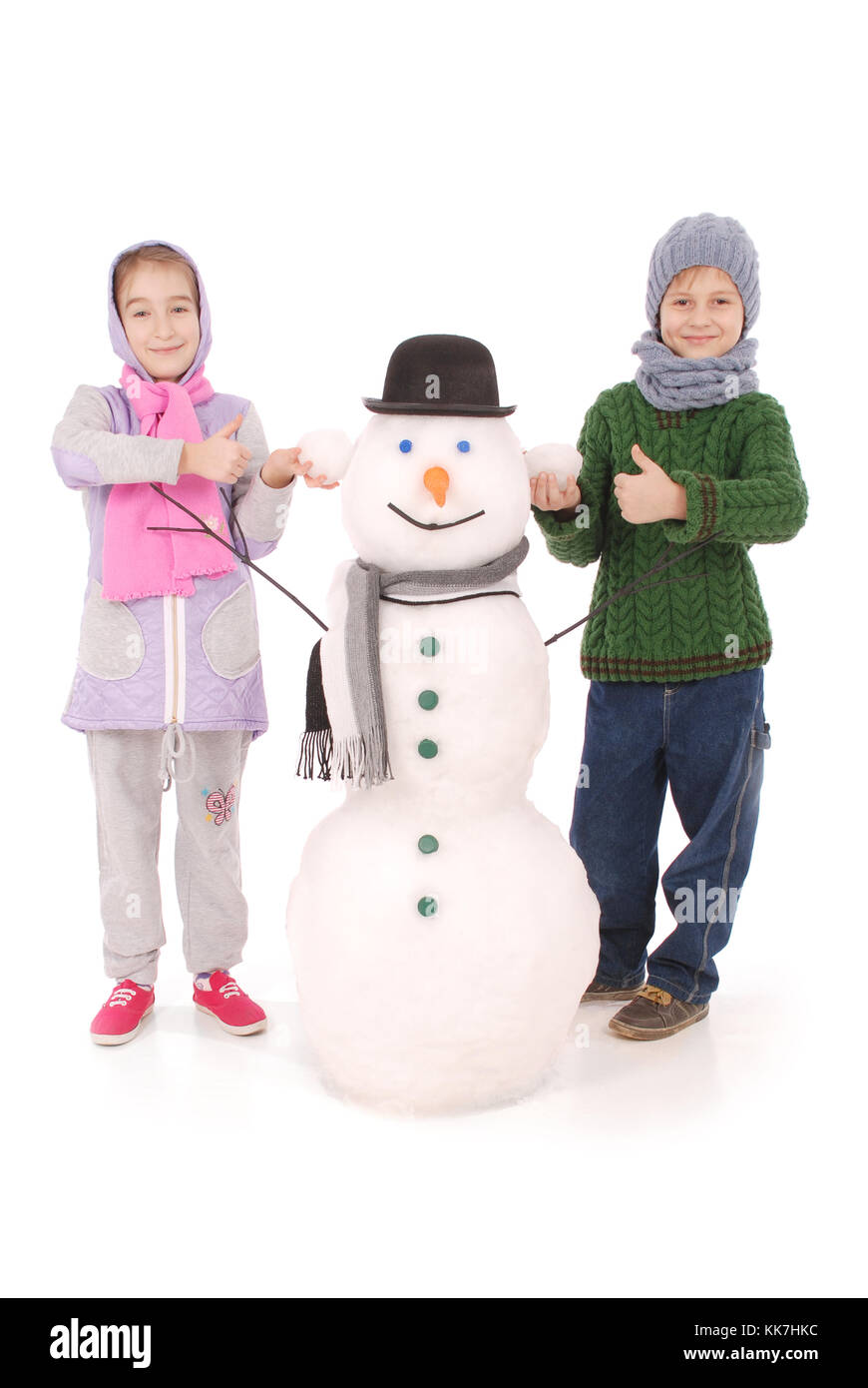 Cute boy and girl with snowman with scarf and hat on white background ...