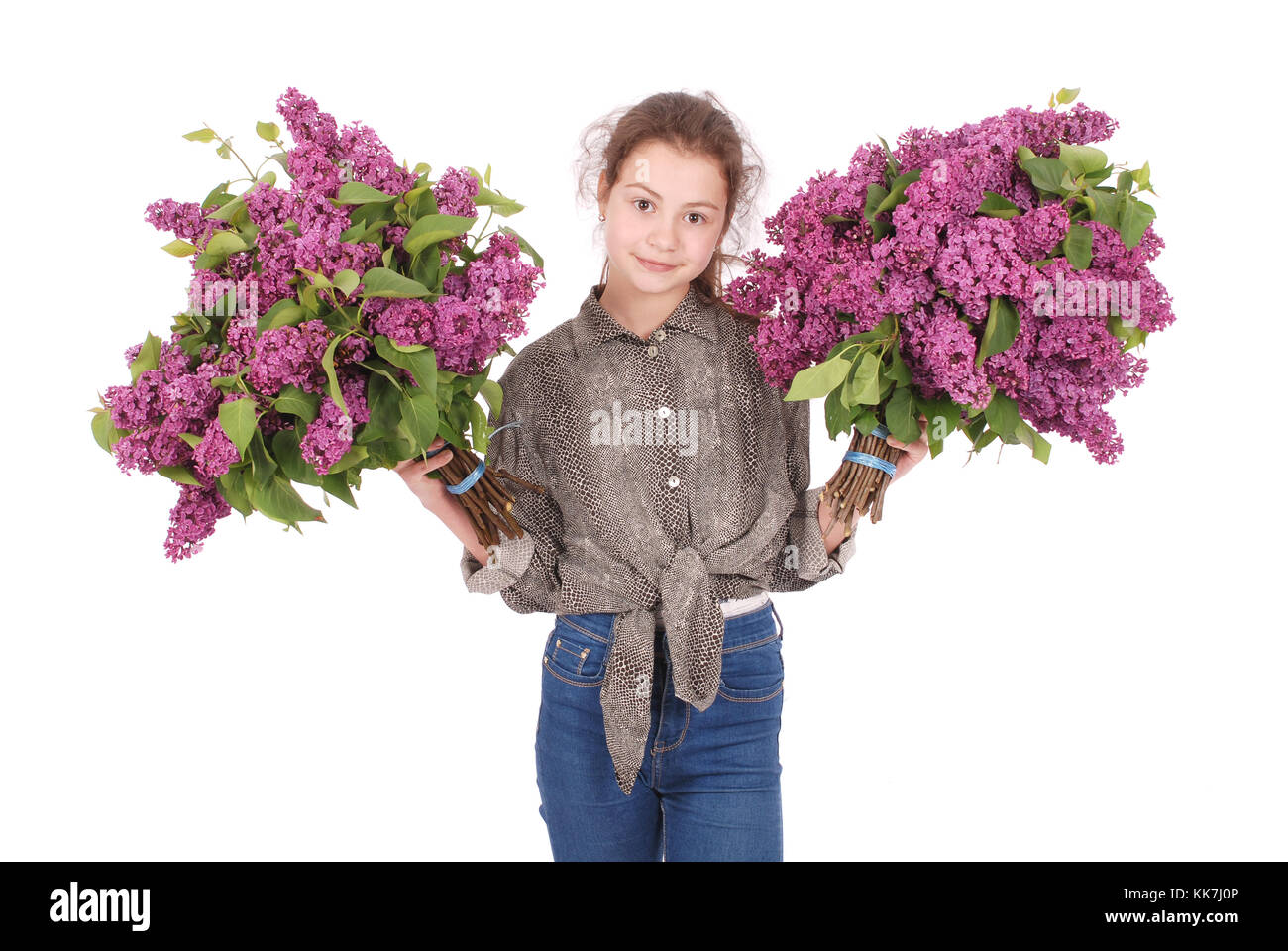 Teenage girl standing with lilac in both hands. Isolated on white ...