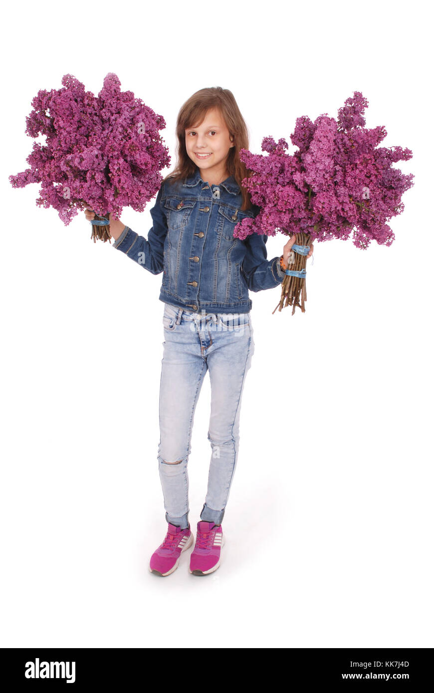 Teenage girl standing with lilac in both hands. Isolated on white ...