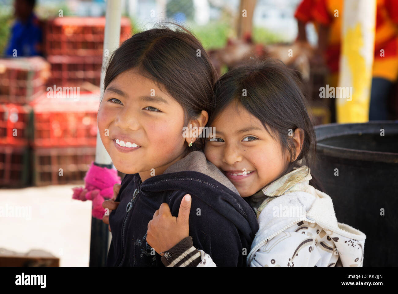Ecuador children - two young indigenous Ecuadorian girls aged 8-10 years; Otavalo, Ecuador South America Stock Photo