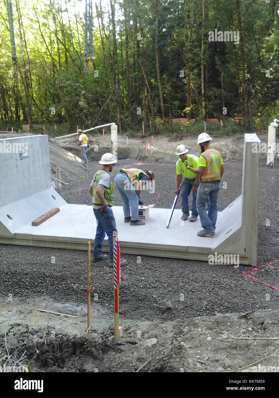 This photo shows crews installing a large box culvert that will carry