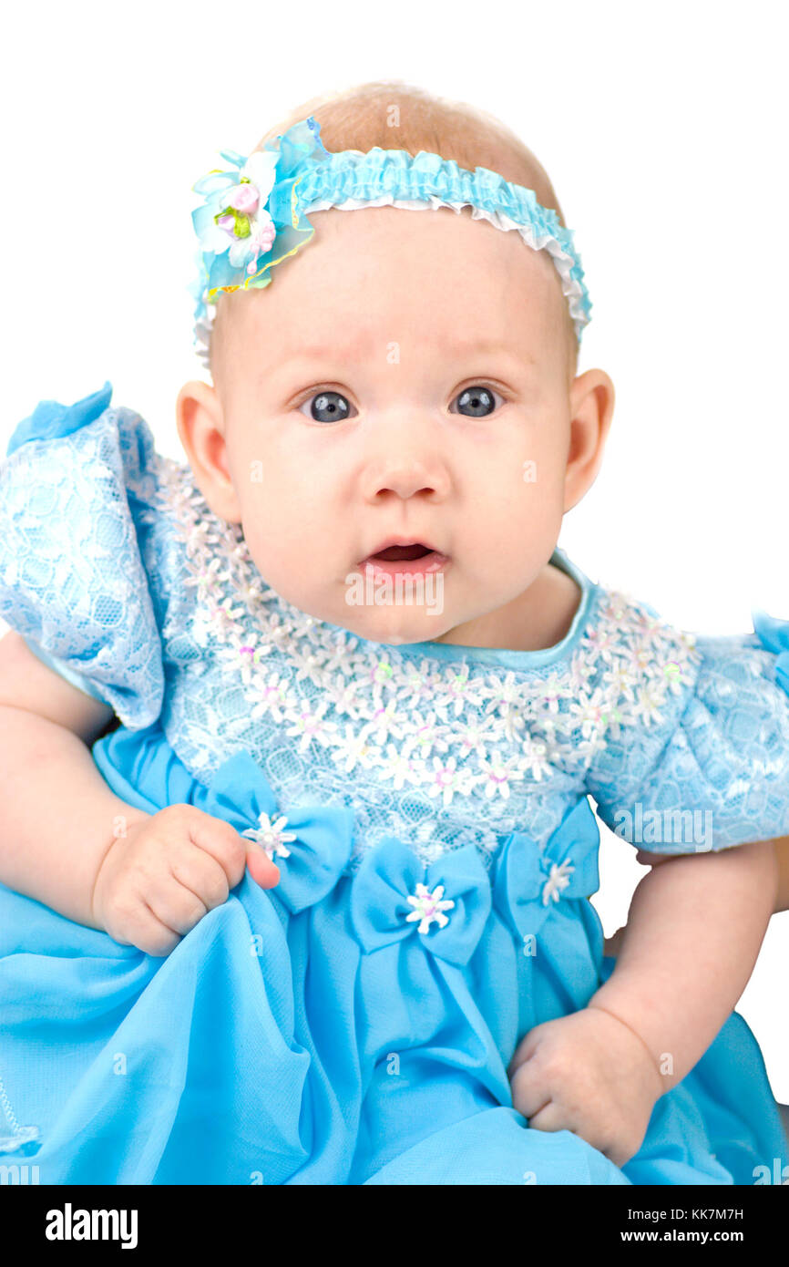 Baby girl in the age of 4 months wearing holiday blue dress and bow  isolated on white Stock Photo - Alamy