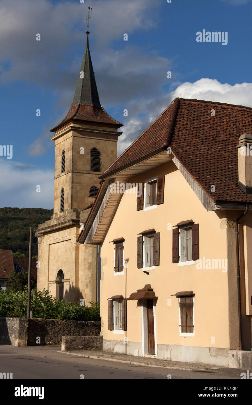 Town of Le Landeron, Switzerland. Picturesque view of Le Landeron’s Rue Saint Maurice, with the Catholic church in the background. Stock Photo