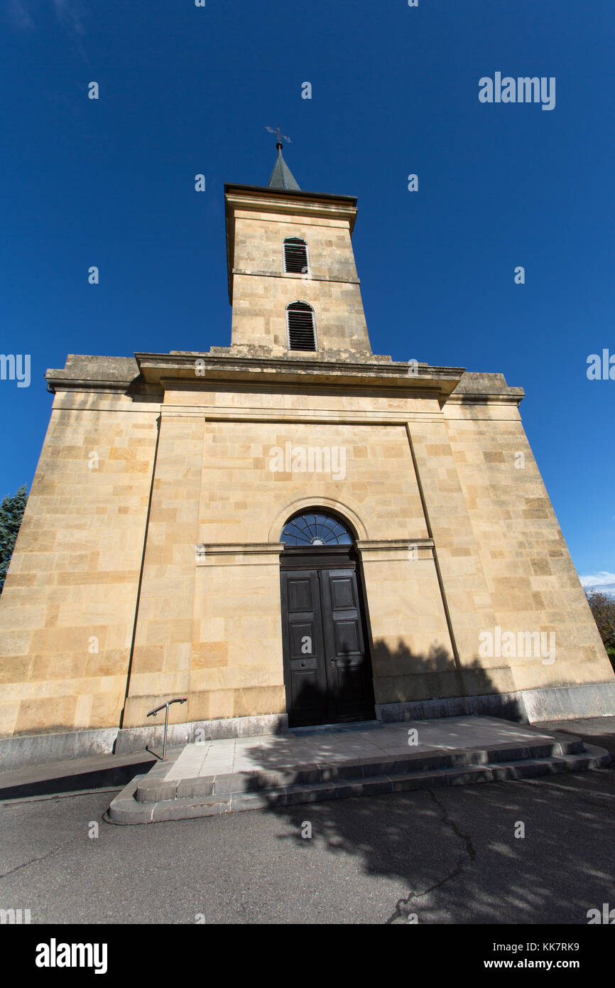 Town of Le Landeron, Switzerland. Picturesque view of Le Landeron’s Catholic church at Rue Saint Maurice. Stock Photo