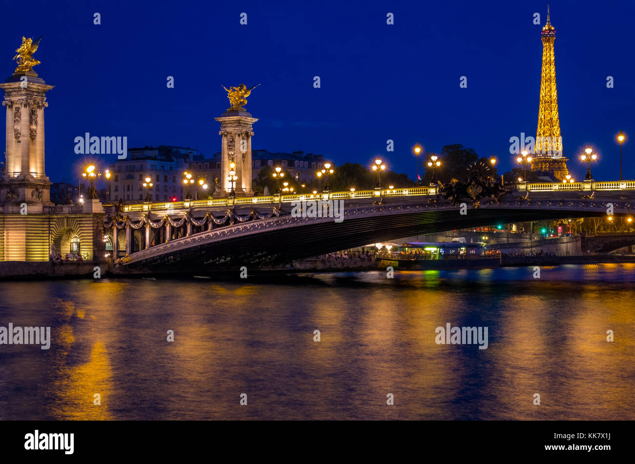 The Pont Alexandre III is a deck arch bridge across the river Seine in Paris. It connects the Champs-Élysées quarter with those of the Invalides and E Stock Photo