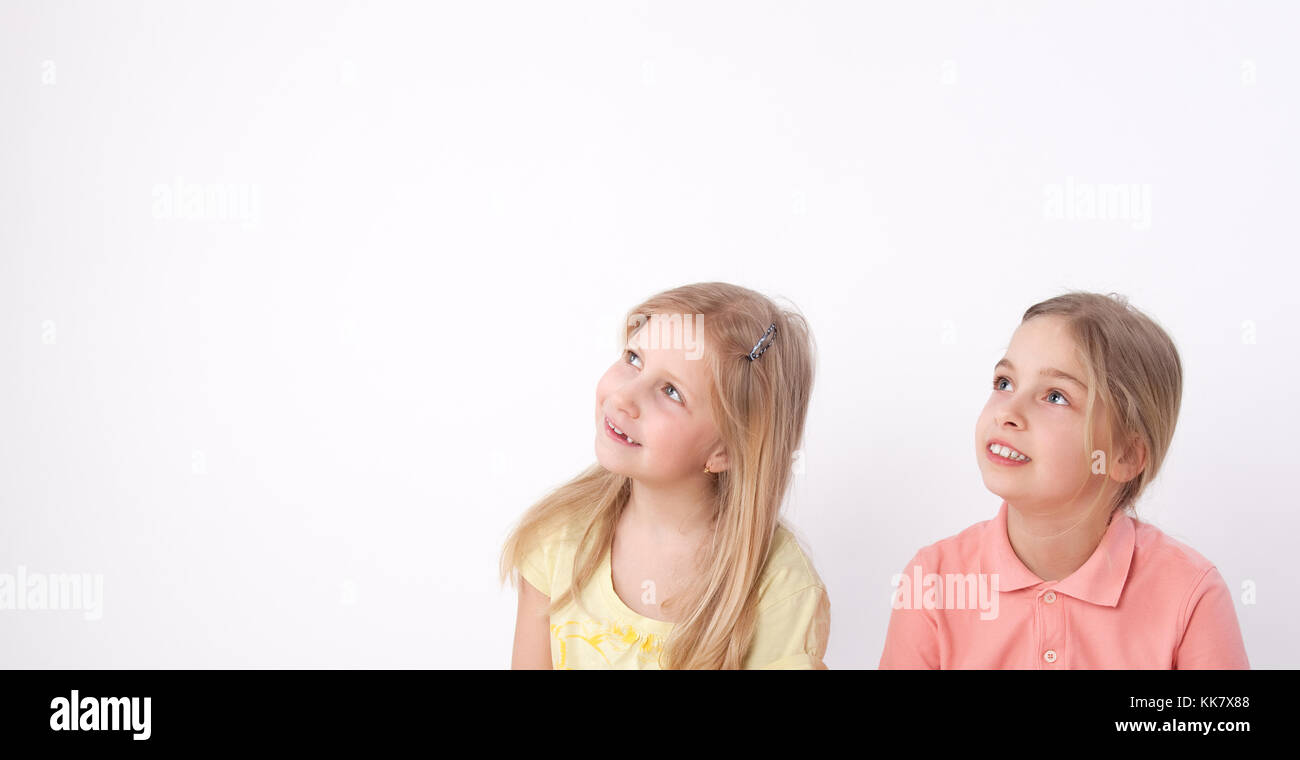 two young girls looking up Stock Photo