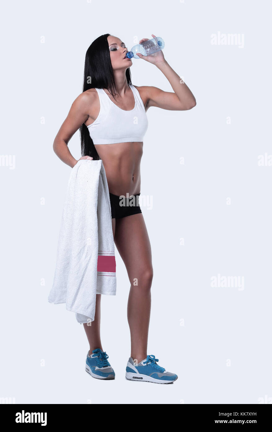 Sporting girl drinking water during exercise Stock Photo Alamy