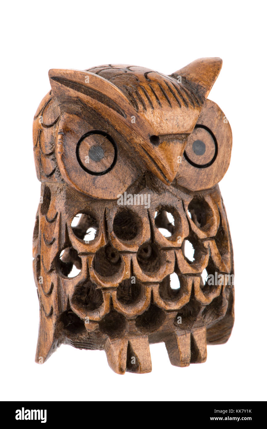 Decorative woodcarved owl inside a owl isolated on white Stock Photo