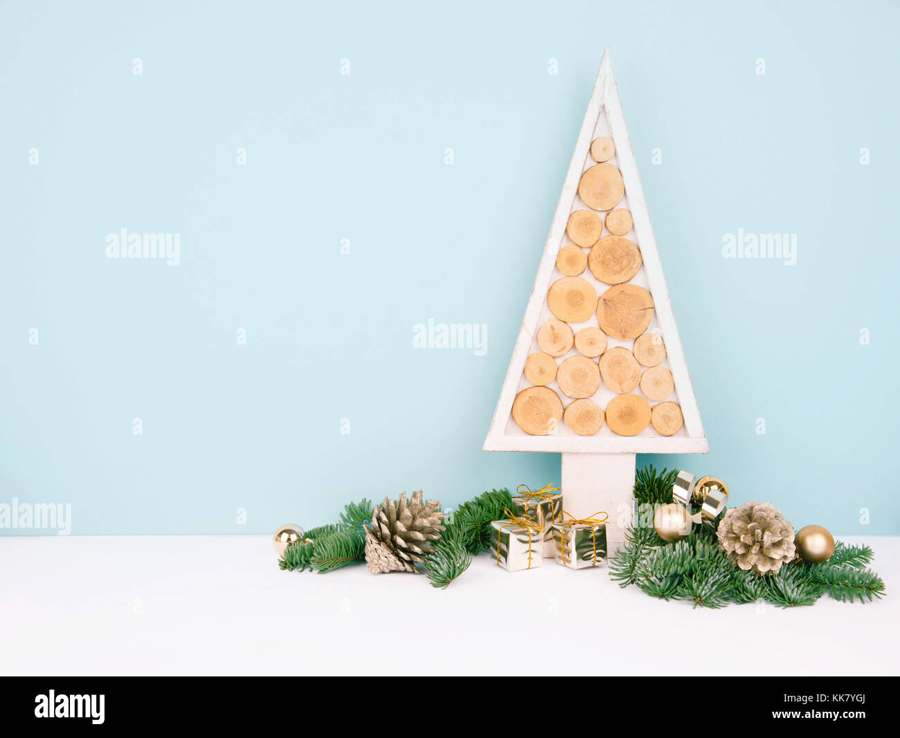 Christmas wooden tree over dark light blue background Stock Photo - Alamy