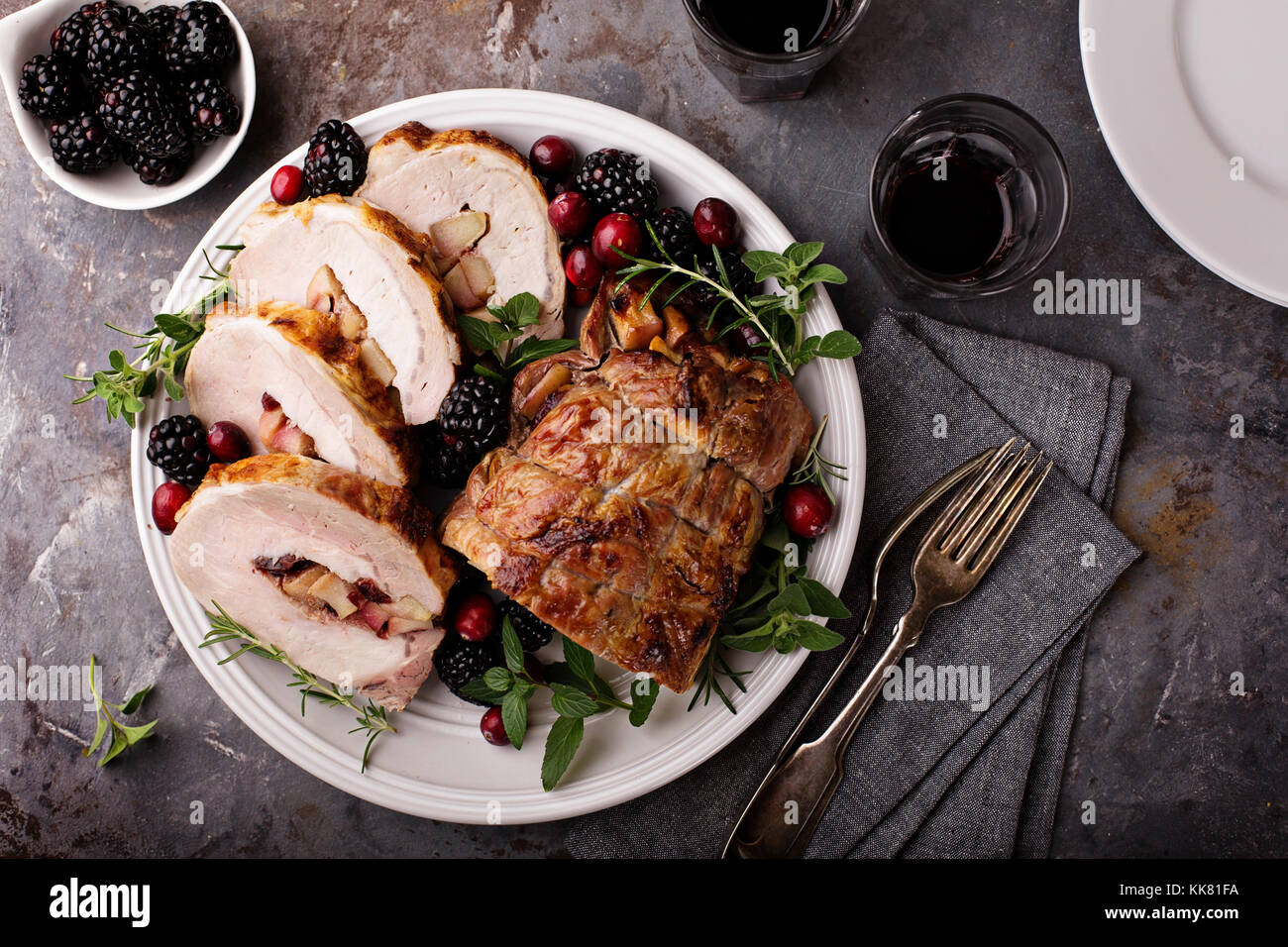 Roasted pork loin stuffed with apple and cranberry Stock Photo