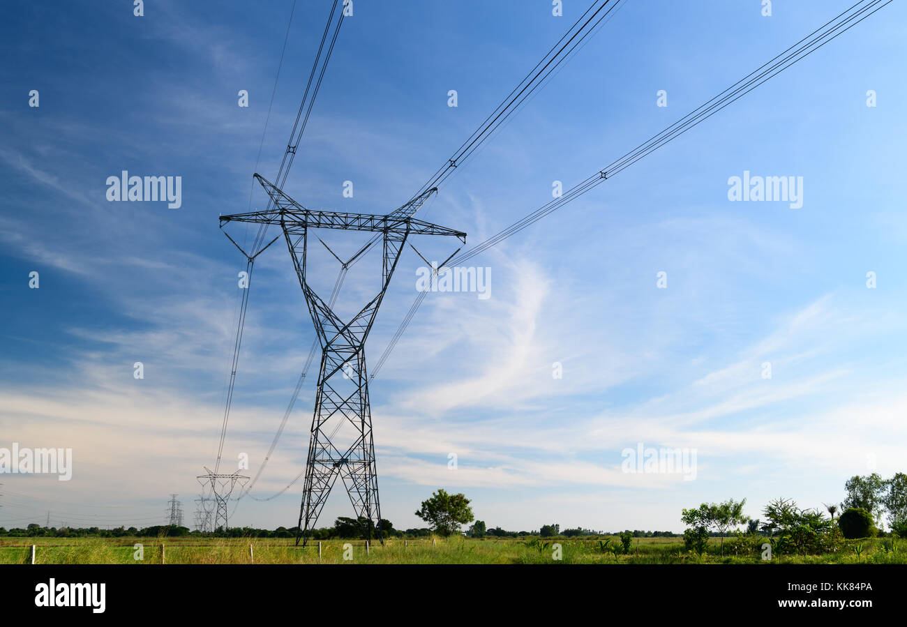 high voltage pole with white cloudy and blue sky Stock Photo - Alamy