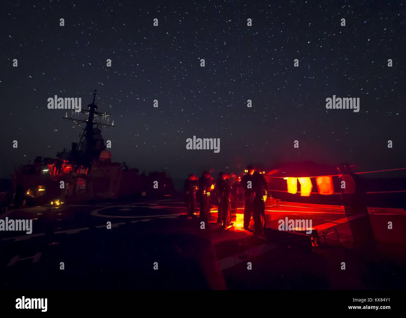 Sailors aboard the guided-missile destroyer USS Ross DDG 71 participate in a low-light small arms training exercise, Mediterranean Sea. Image courtesy Mass Communication Specialist 3rd Class Robert S. Price/US Navy, Spain, 2015. Stock Photo