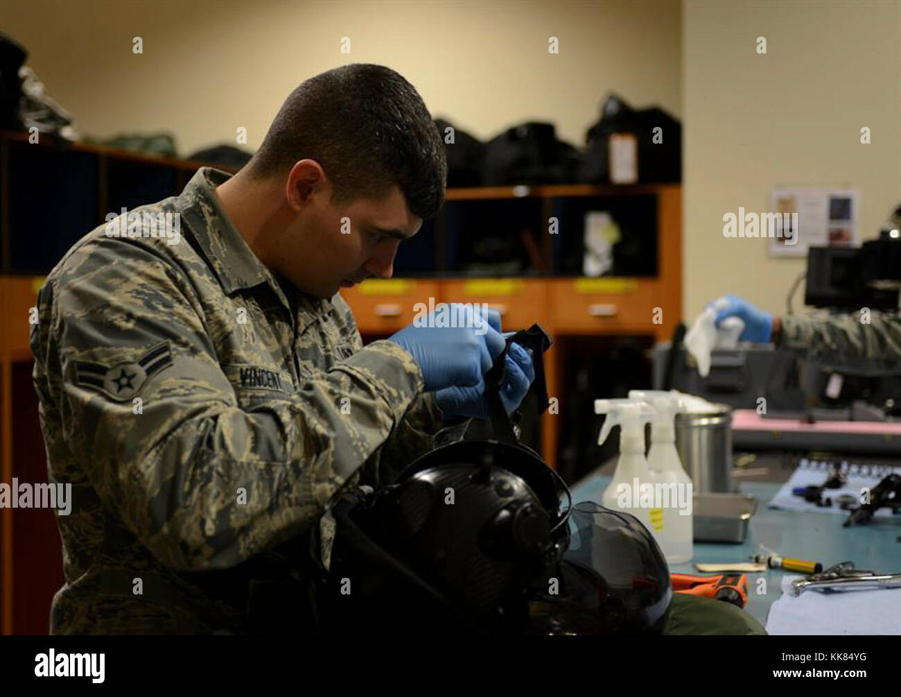 Airman 1st Class Jake Vincent, 56th Operations Support Squadron aircrew flight equipment journeyman, performs preventative maintenance on a Generation II F-35 Lightning II helmet, Dec. 1, 2016, at Luke Air Force Base, Ariz. Checking and cleaning flight equipment is a requirement for the 30-day inspection process. (U.S. Air Force photo by Airman 1st Class Alexander Cook) Stock Photo