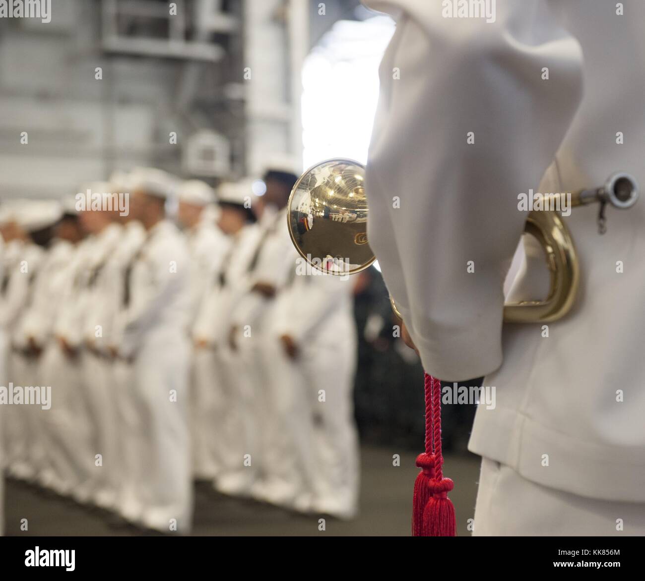 A Sailor prepares to play taps in honor of Logistics Specialist 2nd Class Randall S Smith during a memorial ceremony aboard the amphibious assault ship USS Wasp LHD 1, Norfolk, Virginia. Image courtesy Mass Communication Specialist 3rd Class Rawad Madanat/US Navy, 2015. Stock Photo