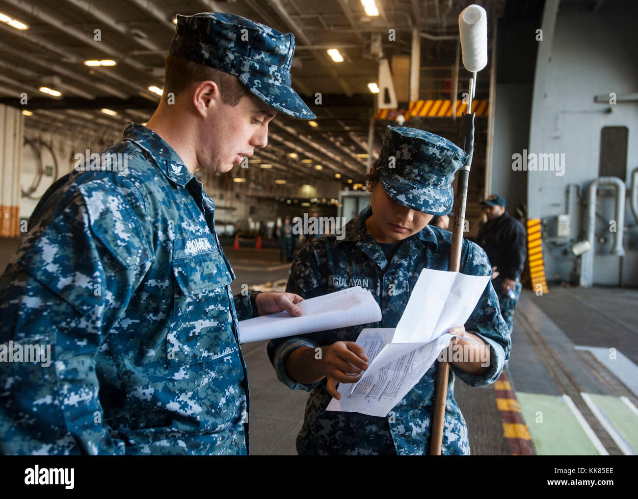 NORFOLK (Nov. 2, 2017) Aviation Boatswain’s Mate (Handling) 3rd Class Jason Comeau, left, and