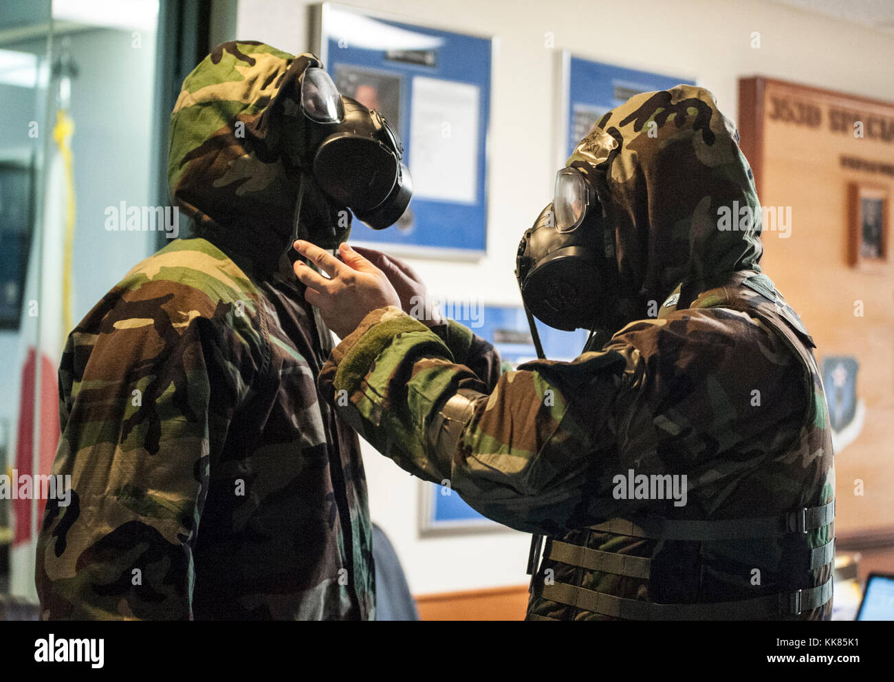 U.S. Air Force 353rd Special Operations Group Airmen don protective gear during an Ability to Survive and Operate (ATSO) exercise Nov. 3, 2017, at Kadena Air Base, Japan. The integrated ATSO and chemical, biological, radiological and nuclear (CBRN) readiness exercise educated Airmen on protective measures for CBRN defense. (U.S. Air Force photo by Capt. Jessica Tait) Stock Photo