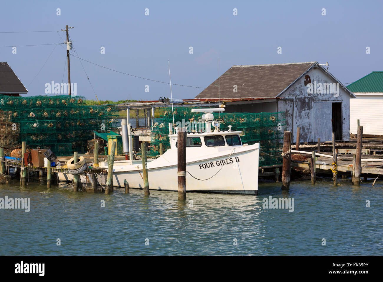 Crab pots, shanty, and deadrise workboat, Tangier Island, Virginia Stock Photo