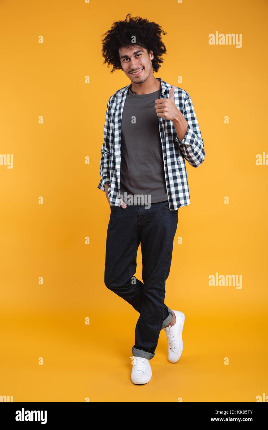Full length portrait of a confident young african man standing and ...