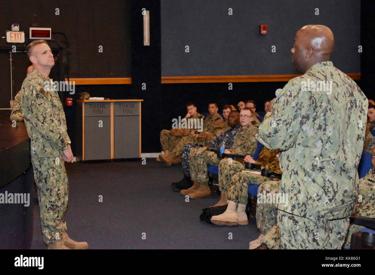 Chief of Naval Personnel Vice Adm. Robert Burke, left, listens to a ...