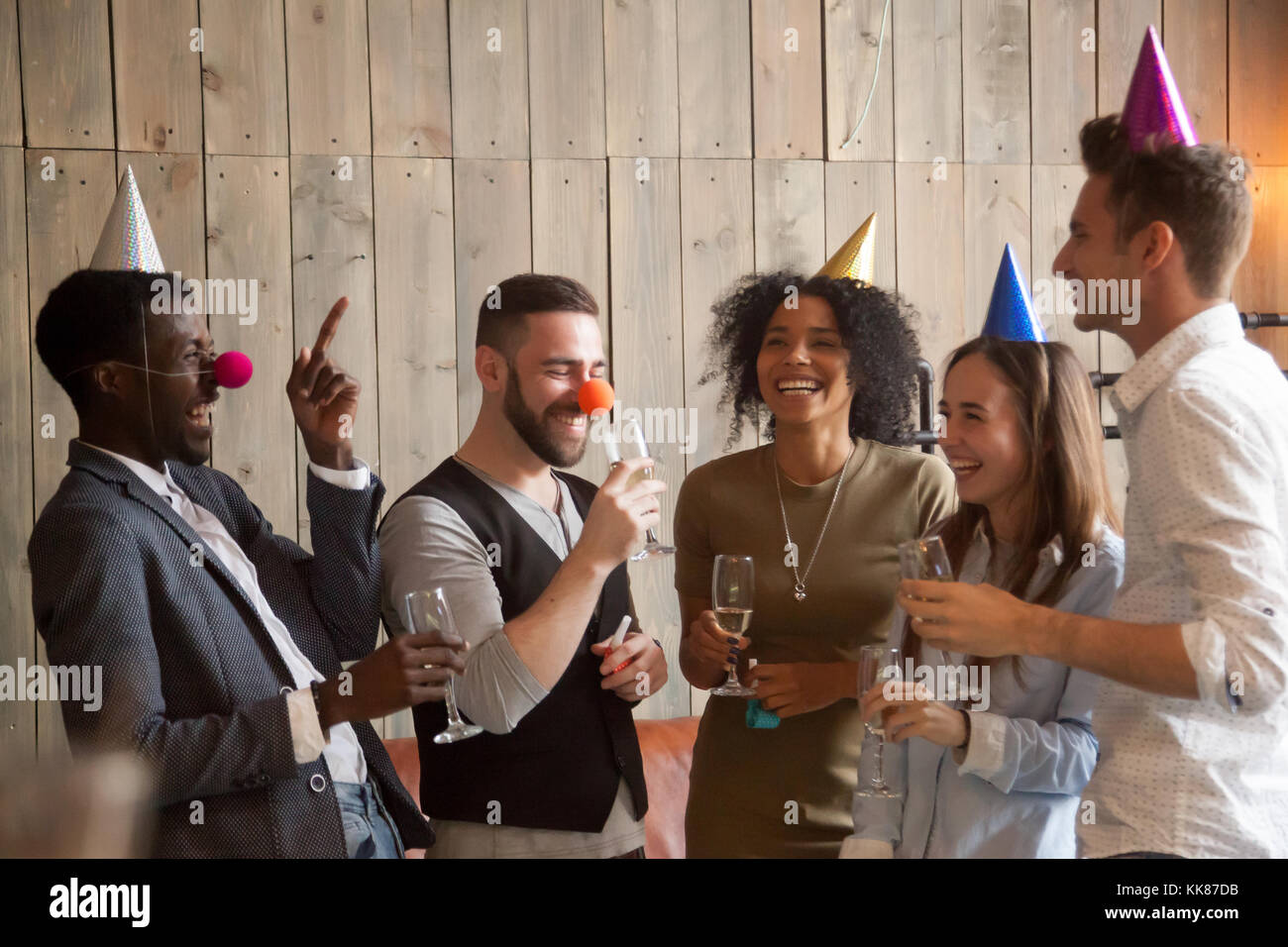 Multiracial diverse friends joking laughing having fun celebrati Stock Photo
