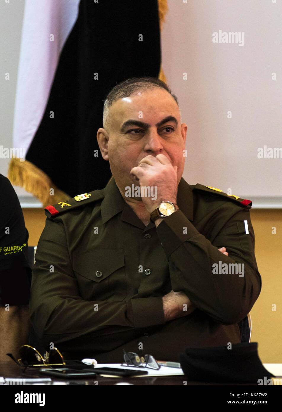 CAMP TAJI, Iraq (Nov. 7, 2017) – Staff Maj. Gen. Hassan Hillel Al-Maliki, director of Iraqi maintenance with the Iraqi forces, contemplates the ideas and discussions at logistics symposium. Iraqi and U.S. forces met and discussed upcoming operations by sharing intelligence, developing security strategies and targeting plans. The symposium promotes interoperability between the countries. (U.S. Army photo by Sgt. Jaccob Hearn) Stock Photo