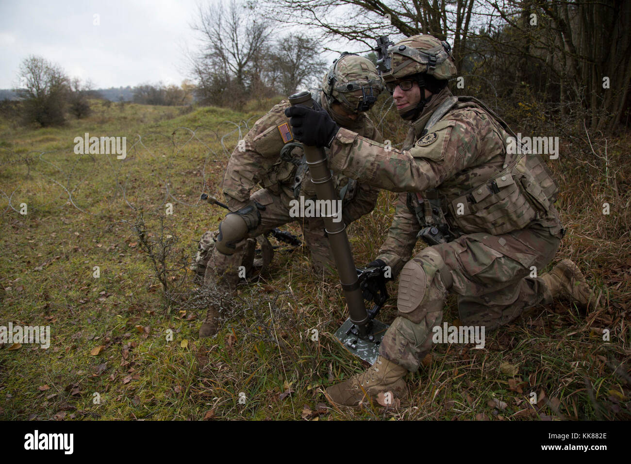 U.S. Soldiers of 2nd Cavalry Regiment, load a M224 60 mm mortar system while conducting defensive operations during exercise Allied Spirit VII at the U.S. Army’s Joint Multinational Readiness Center in Hohenfels, Germany, Nov. 8, 2017. Approximately 4,050 service members from 13 nations are participating in exercise Allied Spirit VII at 7th Army Training Command’s Hohenfels Training Area, Germany, Oct. 30 to Nov. 22, 2017. Allied Spirit is a U.S. Army Europe-directed, 7ATC-conducted multinational exercise series designed to develop and enhance NATO and key partner’s interoperability and readin Stock Photo