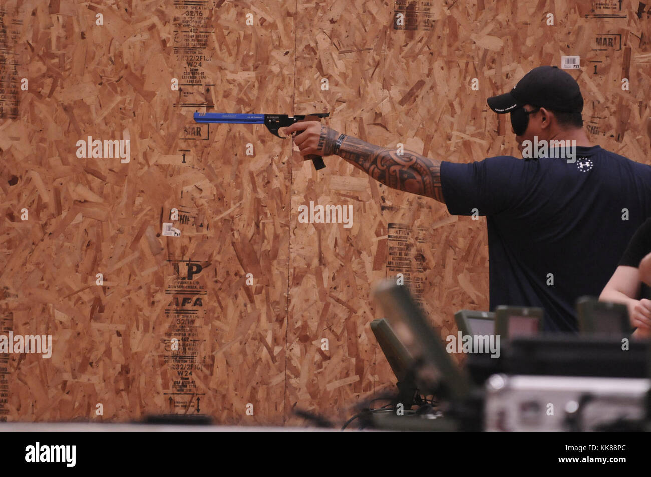 U.S. Army veteran Jerome Faasu, a Hawaiia native, competes in the shooting competition at the