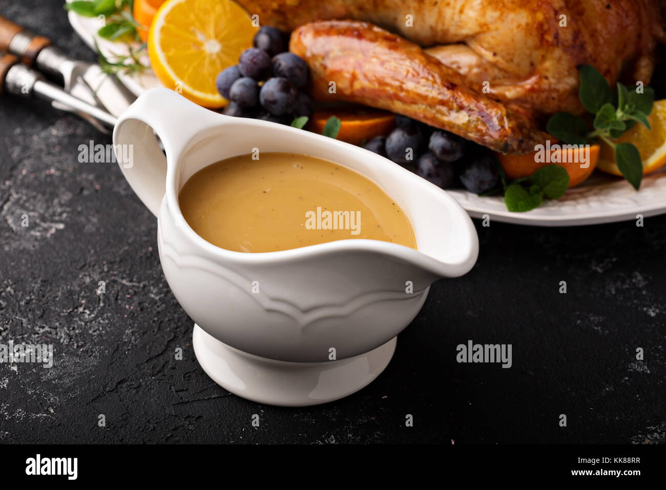 Homemade gravy in a sauce dish with turkey Stock Photo