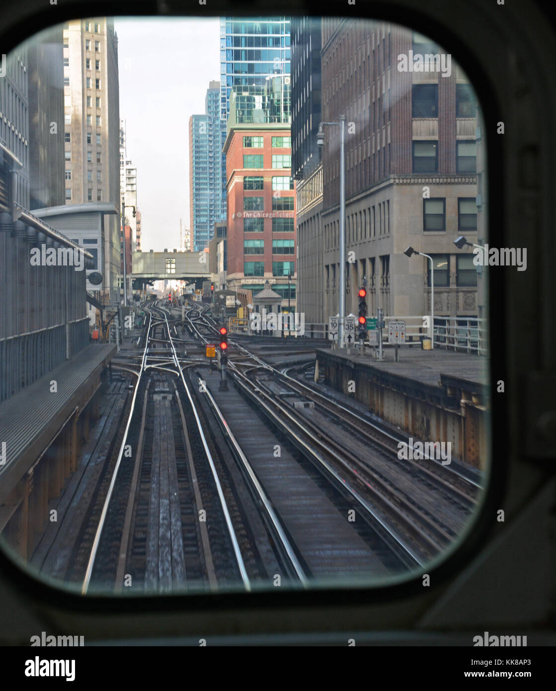 The L tracks in Chicago's downtown Loop are framed outside the window of the last car on a Brown