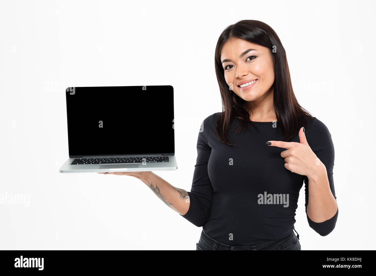 Image of happy young asian lady standing isolated over white background ...
