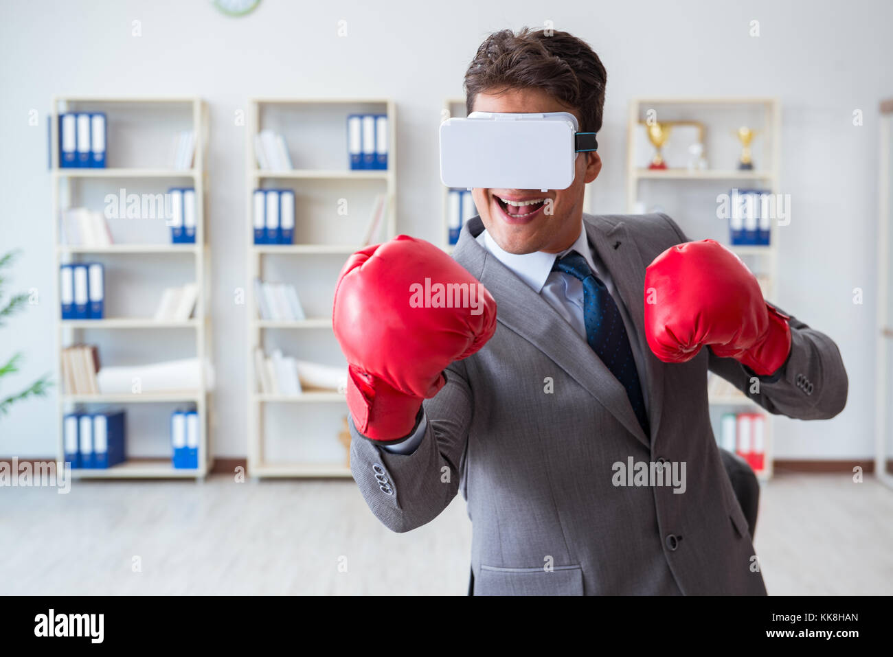 Man boxing in the office with virtual reality goggles Stock Photo Alamy