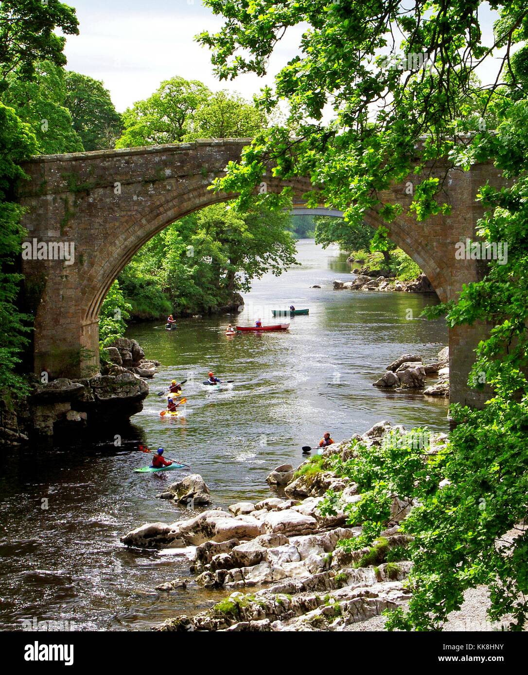 The Devils Bridge over the River Lune at the town of Kirkby Lonsdale, Cumbria. Canoeing, kayaking. England. Stock Photo